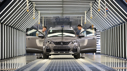 Employees work at a Dongfeng Peugeot-Citroen factory in Chengdu, Sichuan Province.