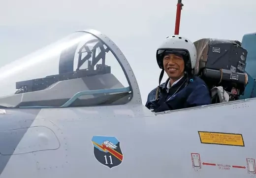 Indonesia's President Joko Widodo sits in the cockpit of a Sukhoi fighter jet while attending a military exercise at Ranai military airbase in Natuna Island, Riau Islands province, Indonesia October 6, 2016. 
