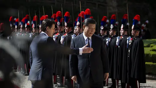 Italian Prime Minister Giuseppe Conte welcomes Chinese President Xi Jinping before their meeting in Rome.
