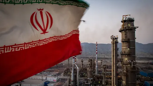 An Iranian national flag flies over a refinery in Bandar Abbas, Iran.