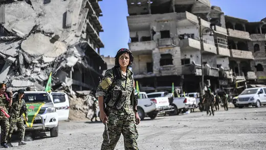 Kurdish fighters of the Syrian Democratic Forces gather in Raqqa, shortly after retaking it from the Islamic State.