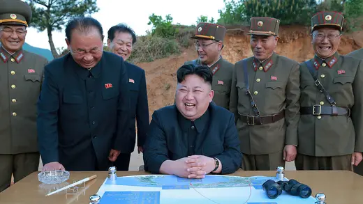 North Korean leader Kim Jong Un reacts during the long-range strategic ballistic rocket test launch.