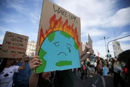 Activists participate in a march calling for action on climate change.