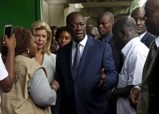 Ivory Coast's President Alassane Ouattara of the Rally of the Houphouetists for Democracy and Peace (RHDP) party talks after casting his vote at a polling station during a presidential election in Abidjan, Côte d'Ivoire on October 25, 2015
