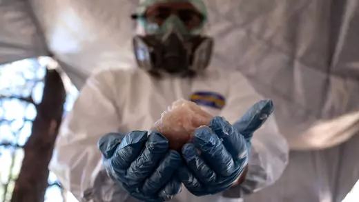 A Mexican Army expert shows crystal meth paste at a clandestine laboratory in Tecate, Mexico.