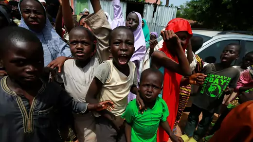 Boys and girls protest and look at the camera in Kaduna, Nigeria.