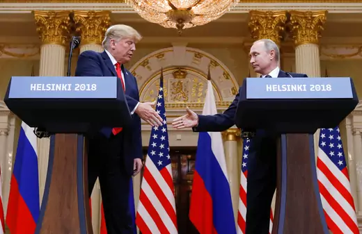 U.S. President Donald Trump and Russia's President Vladimir Putin shake hands during a joint news conference after their meeting in Helsinki, Finland, July 16, 2018.