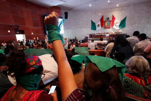 A pro-choice demonstrator rises her fist during a session of the local congress as lawmakers are due to vote on legislation that decriminalized abortion in Oaxaca, Mexico September 25, 2019.