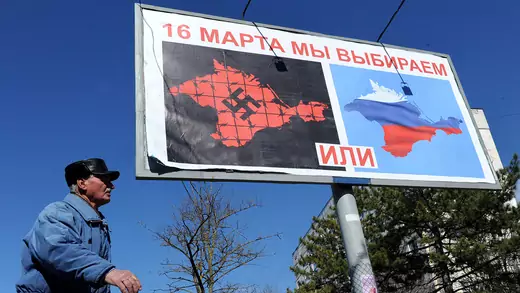 A campaign poster during the Crimean referendum compares authorities in Kyiv to Nazis