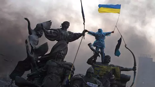 A protester waves a Ukrainian flag in the Euromaidan protests