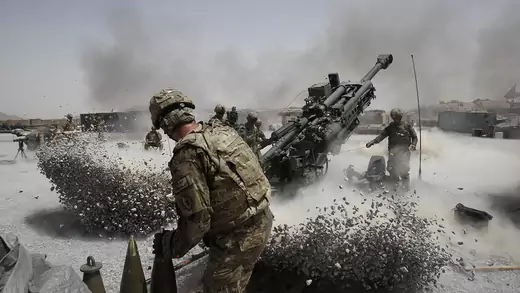U.S. Army soldiers fire a howitzer artillery piece in Kandahar Province on June 12, 2011.