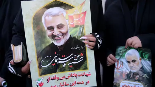 Women hold pictures of Iranian Major-General Qassem Soleimani, head of the elite Quds Force, who was killed in an air strike at Baghdad airport, during a funeral procession and burial at his hometown in Kerman, Iran, on January 7, 2020.