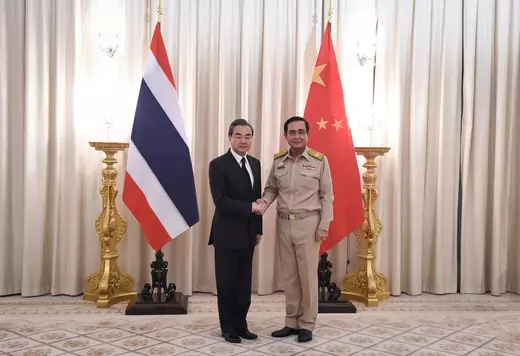 Chinese Foreign Minister Wang Yi (L) shakes hands with Thai Prime Minister Prayuth Chan-ocha (R) at Government House in Bangkok, Thailand on July 24, 2017.