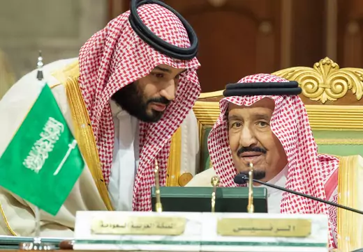 Saudi Crown Prince Mohammed bin Salman speaks to his father, King Salman bin Abdulaziz Al Saud, in December 2018. Saudi Royal Court via Reuters. 