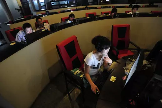 People use computers at an internet cafe in Hefei, Anhui province