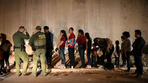 Migrant families wait in line to seek asylum with U.S. Border Patrol agents in Hidalgo, Texas.