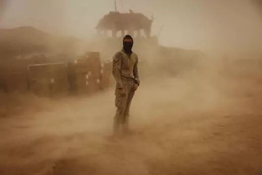 Private First Class Brandon Voris, 19, of Lebanon, Ohio, from the First Battalion Eighth Marines Alpha Company stands in the middle of his camp as a sandstorm hits his remote outpost near Kunjak in southern Afghanistan's Helmand province.