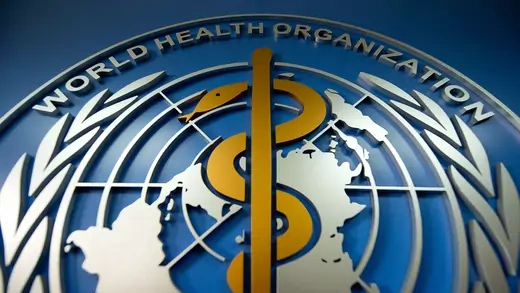 A World Health Organization (WHO) logo is displayed at its office in Beijing.