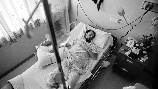 Deotis McMather, an AIDS patient, sleeps in his bed at a San Francisco hospital in 1983.