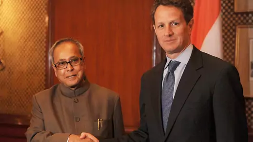 Timothy Geithner shakes hands with Pranab Mukherjee during a meeting in New Delhi. 
