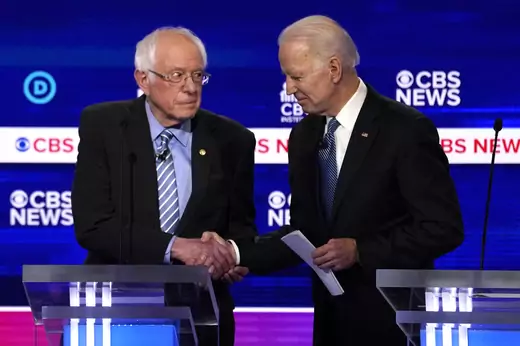Presidential candidates Senator Bernie Sanders (L) and former Vice President Joe Biden (R) shake hands at the February 25 Democratic debate. 