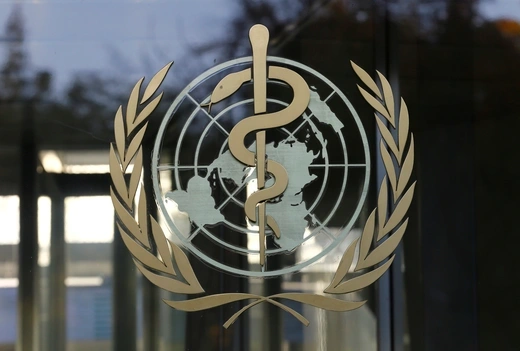 A logo is pictured on the World Health Organization (WHO) headquarters.