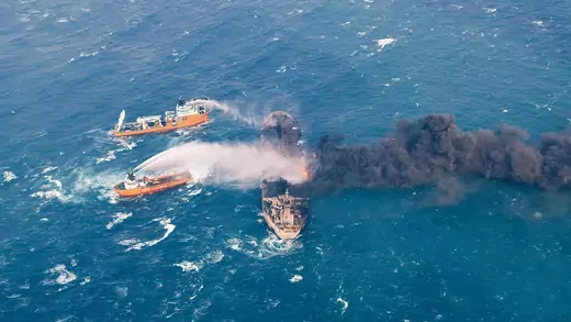 Rescue crews attempt to extinguish the fire on the Sanchi oil taker in the East China Sea.  China Daily via Reuters