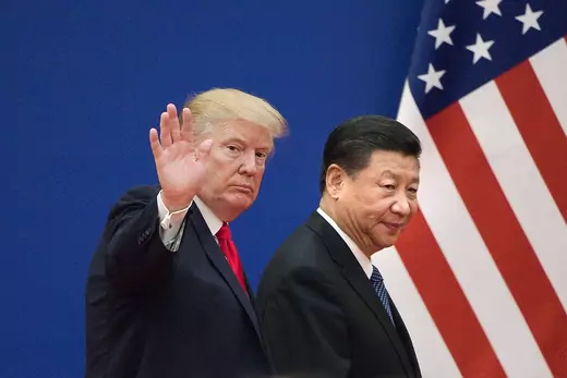 US President Donald Trump (L) and China's President Xi Jinping leave a business leaders event at the Great Hall of the People in Beijing.
