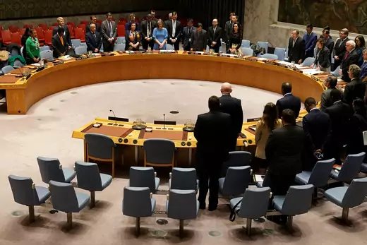 Members of the United Nations Security Council observe a moment of silence at the beginning of a meeting.