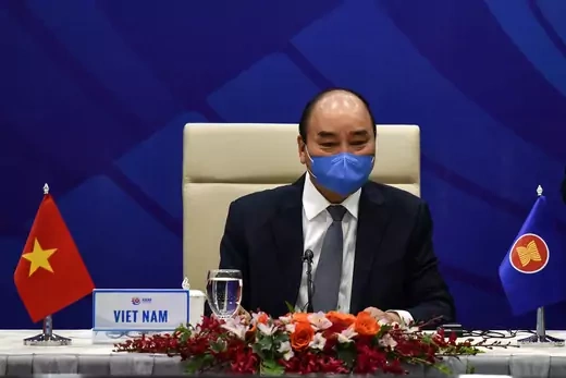 Vietnam's Prime Minister Nguyen Xuan Phuc waits for the start of a special video conference with leaders of the Association of Southeast Asian Nations (ASEAN) on the coronavirus disease (COVID-19), in Hanoi on April 14, 2020.