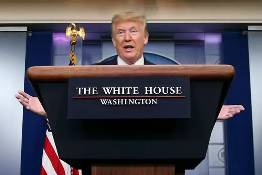 U.S. President Donald J. Trump stands behind a podium as he speaks during a White House press conference.