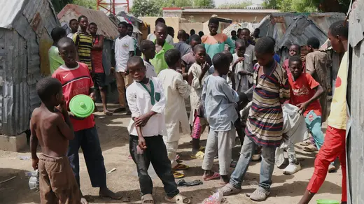 Young boys, who attend Nigeria's Islamic schools, known as almajiris, stand in crowds in Tudunwada, as authorities struggle to contain coronavirus disease (COVID-19) in Maiduguri, Nigeria April 24, 2020.