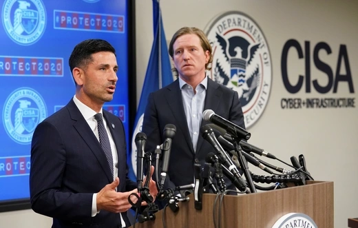 Department of Homeland Security (DHS) Acting Secretary Chad Wolf (L) and Cybersecurity and Infrastructure Security Agency (CISA) Director Christopher Krebs speak to reporters.