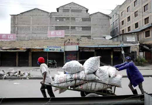 People in Nairobi, Kenya, move a cart after the government announced a lockdown on May 7, 2020.