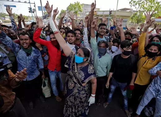 Migrant workers shout slogans during a protest demanding train service to their home state of eastern Bihar, after a limited reopening of India's giant rail network following a nearly seven-week lockdown to slow the spread of the coronavirus disease.