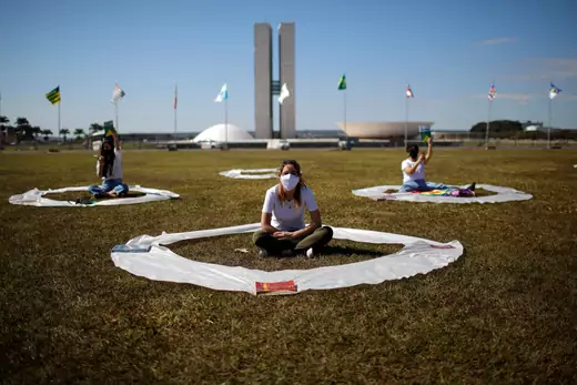 Demonstrators take part in a protest against Brazil's President Jair Bolsonaro as they maintain social distance in front of the National Congress, amid the coronavirus disease (COVID-19) outbreak, in Brasilia, Brazil.