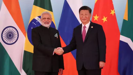 Indian Prime Minister Narendra Modi (left) shakes hands with Chinese President Xi Jinping (right).