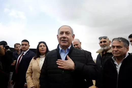 Israeli Prime Minister Benjamin Netanyahu gestures during an event marking Tu BiShvat, the Jewish Arbor Day, in the Israeli settlement of Mevo'ot Yericho, in the Israeli-occupied West Bank.