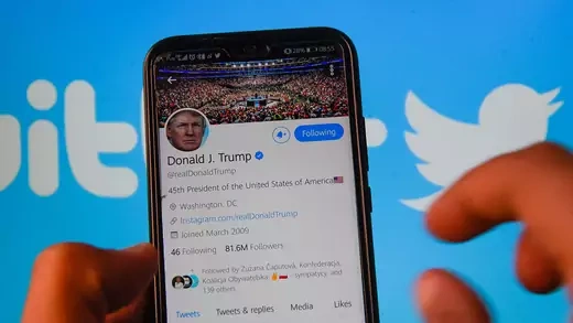 President Donald Trump's Twitter profile is shown against a backdrop of the Twitter logo.