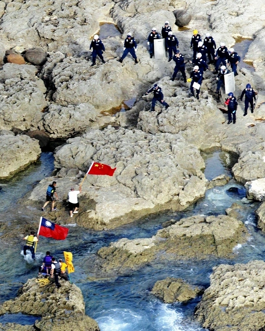 Hong Kong activists land on the Diaoyu/Senkaku Islands with Chinese and Taiwanese flags on August 15, 2012.