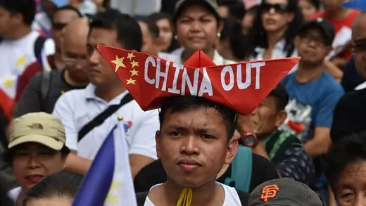 People protest against China outside the Chinese consular office in Manila.