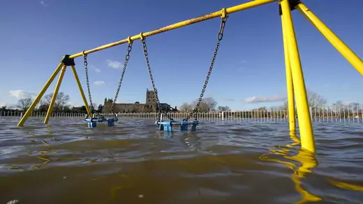 Tewkesbury Abbey and a children's playground at the confluence of the Rivers Severn and Avon, is surrounded by flood waters on February 27, 2020 in Tewskesbury, England.