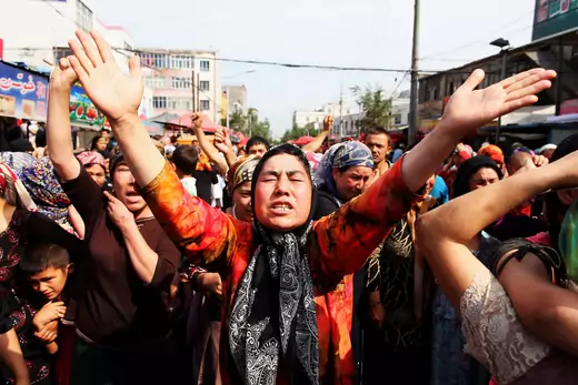 Uighur people protest at a street on July 7, 2009 in Urumqi, the capital of Xinjiang Uighur autonomous region, China.