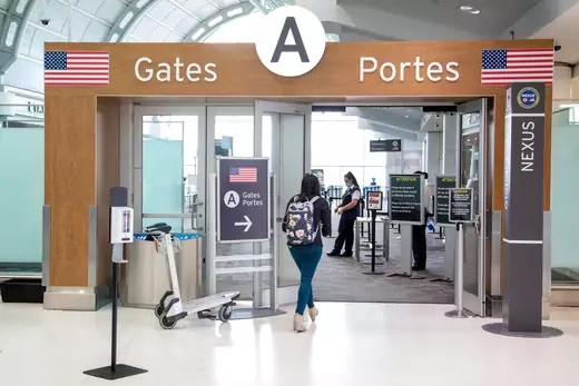 Woman walks through airport security