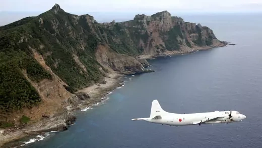 A Japan Maritime Self-Defense Force surveillance plane flies around the Diaoyu/Senkaku Islands in the East China Sea. 