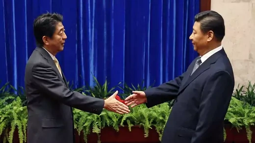 China’s Xi Jinping and Japan’s Shinzo Abe at the APEC summit in Beijing, November 10, 2014.