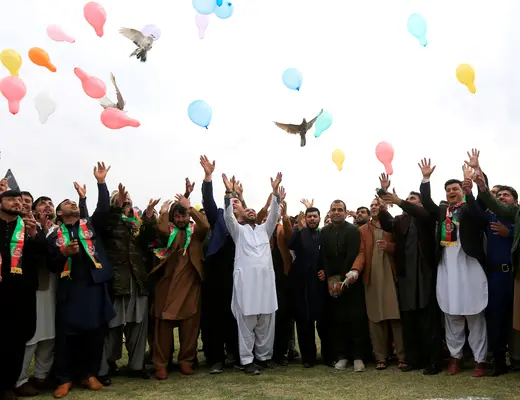 Afghan men celebrate in anticipation of the U.S.-Taliban agreement in Jalalabad, Afghanistan, on February 28, 2020.