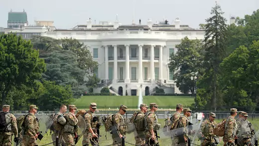 Uniformed military personnel walk in front of the White House ahead of a protest against racial inequality in the aftermath of the death in Minneapolis police custody of George Floyd, in Washington
