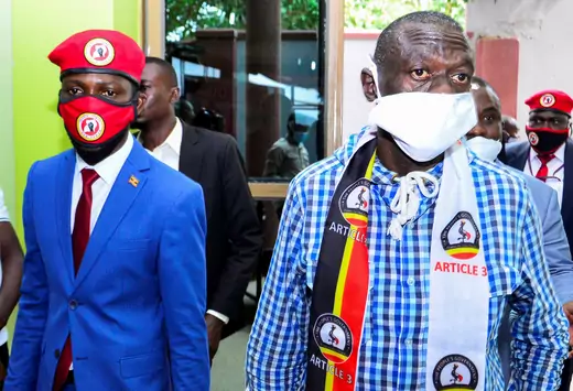 Ugandan musician-turned-politician, Bobi Wine, and Uganda's four time Presidential candidate Kizza Besigye arrive for a joint news conference over the government handling of the coronavirus disease (COVID-19) pandemic and a possible alliance against President Yoweri Museveni in the upcoming elections, in Wakiso district, in Kampala, Uganda June 15, 2020