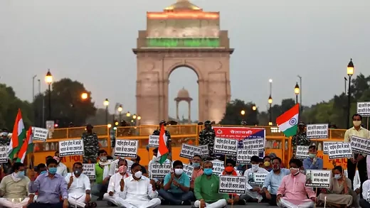 Supporters of India's ruling Bharatiya Jayanta Party (BJP) hold placards to protest against China while paying tributes to the Indian army soldiers killed in a border clash with Chinese troops in Ladakh region, at India Gate, in New Delhi